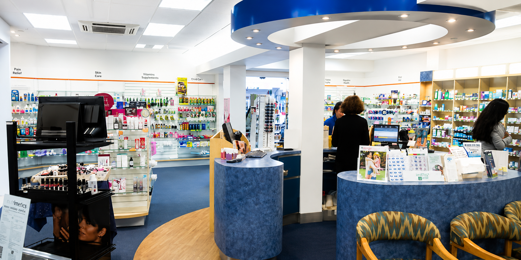 Interior of a pharmacy with customers and staff at the counter.